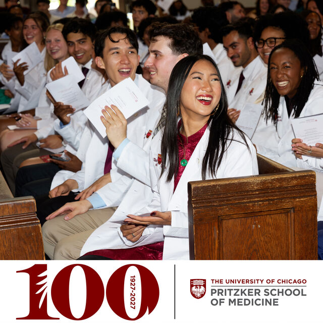 Smiling Pritzker students in their White Coats