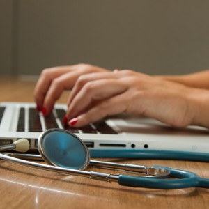 photo of a computer and a stethoscope 