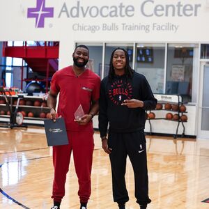 Jameel Alausa with Chicago Bulls star Ayo Dosunmu receiving the MLK Legacy Award 